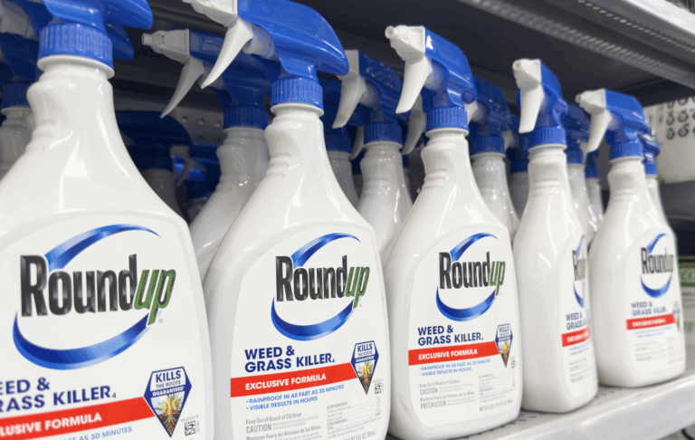 A row of RoundUp spray bottles on a store shelf | Daniel Stark Law